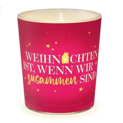Leuchtendes rotes Windlicht mit goldfarbenen Sternen und dem Schriftzug „Weihnachten ist, wenn wir zusammen sind“