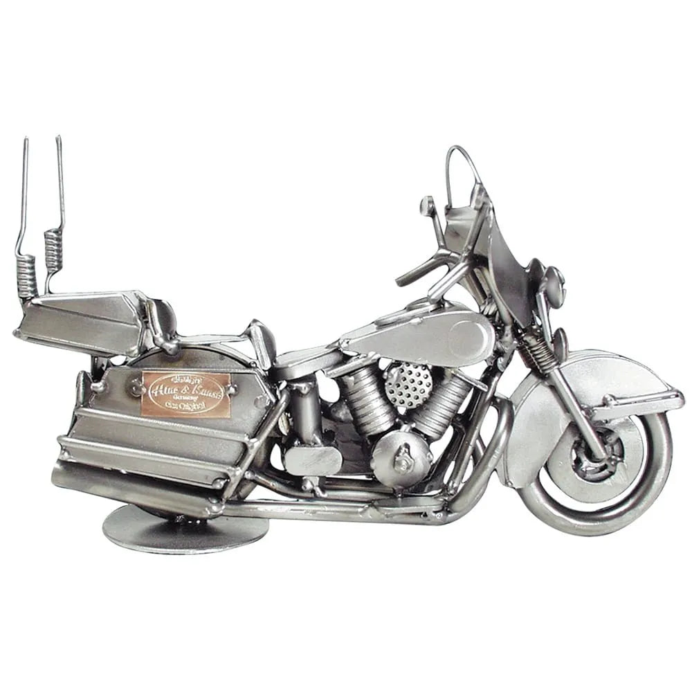 Schraubenfigur eines silberfarbenen Touring-Motorrads mit Windschutzscheibe, Seitenkoffern und Topcase in Seitenansicht