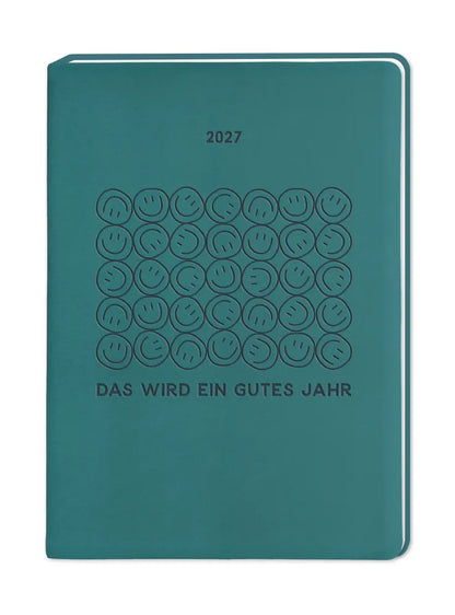 Terminplaner - "Das wird ein gutes Jahr" - 2027 - Cover - Text: "2027 Das wird ein gutes Jahr" Design 5 Reihen mit aufeinander gestapelten Smileys