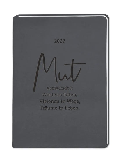 Terminplaner - "Mut" - 2027 - Cover - Text: "2027 Mut verwandelt Worte in Taten, Visionen in Wege, Träume im Leben." Auf schwarzen Hintergrund. 