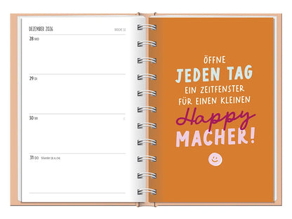 Terminplaner - "Nimm dir Zeit" - 2027 -  To-Do Dezember mit einer Karte. Kartenspruch: "Öffne jeden Tag ein Zeitfenster für einen kleinen happy macher! Kartendesign: Gelber Hintergrund mit einem Smiley unter dem Spruch.