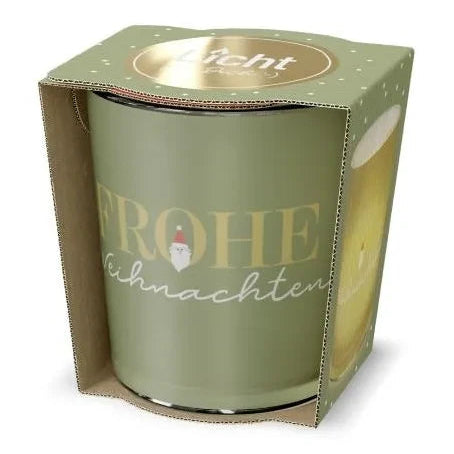Hellgrünes Windlicht mit Schriftzug „Frohe Weihnachten“ und kleinem Weihnachtsmannmotiv in offener hellgrüner Geschenkverpackung