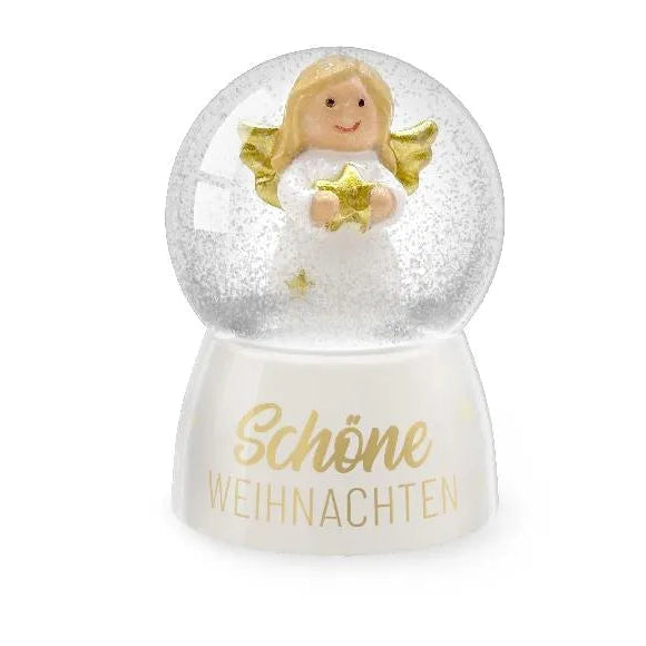 Schneekugel mit Engel, goldfarbenen Flügeln und Stern auf weißem Sockel mit goldenem Schriftzug „Schöne Weihnachten“
