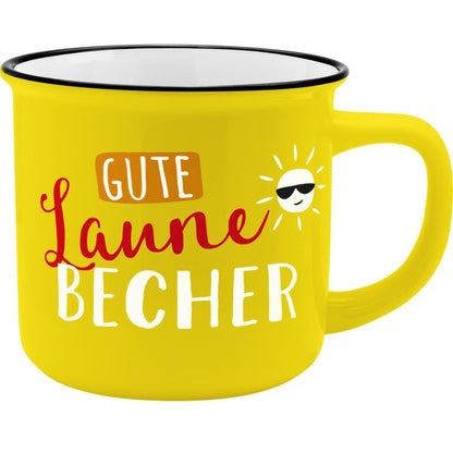 Gelber Porzellanbecher mit Motiv und Spruch "Gute Laune Becher"