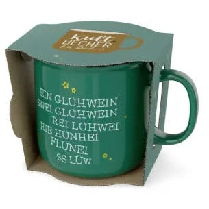 Grüner Kultbecher mit humorvollem Glühwein-Schriftzug und kleinen Sternen in offener grüner Geschenkverpackung