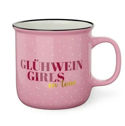 Rosafarbener Kultbecher mit schwarzem Rand, kleinen weißen Sternen und dem Schriftzug „Glühwein Girls“