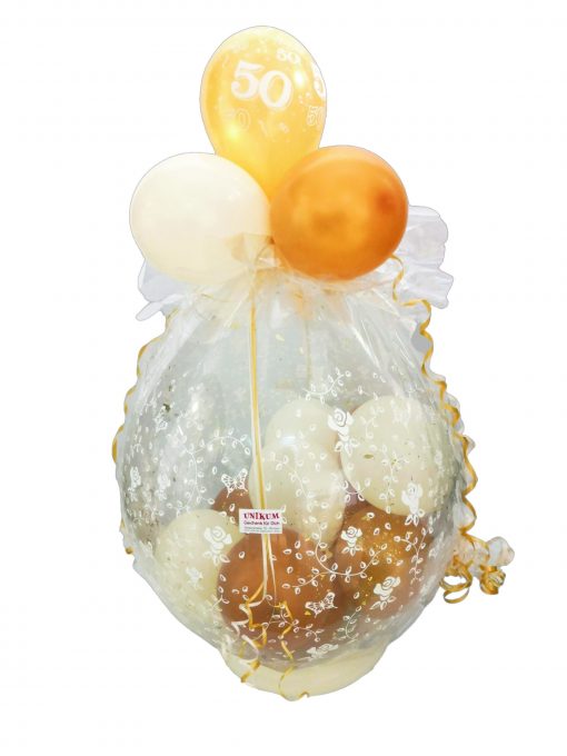 Geschenkballon in gold und creme verpackt in Folie zur goldenen Hochzeit