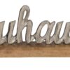Silberner Metall-Schriftzug "Zuhause" auf Holz-Standfuß